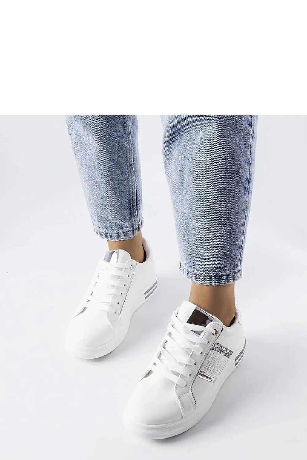 Beige sneakers adorned with rhinestones