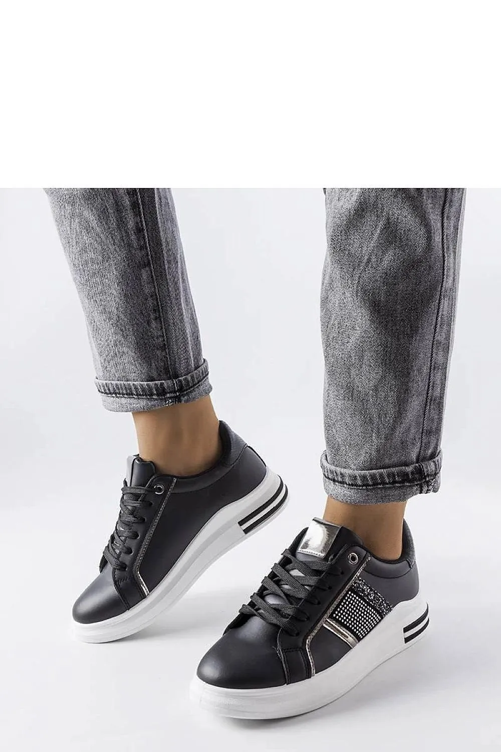 Beige sneakers adorned with rhinestones