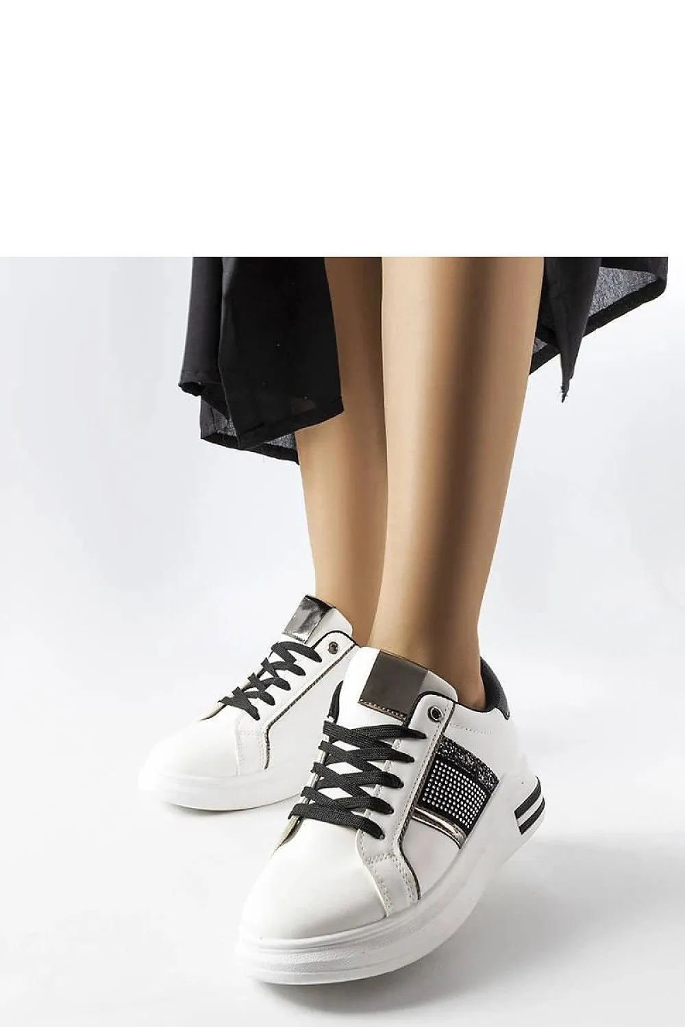 Beige sneakers adorned with rhinestones