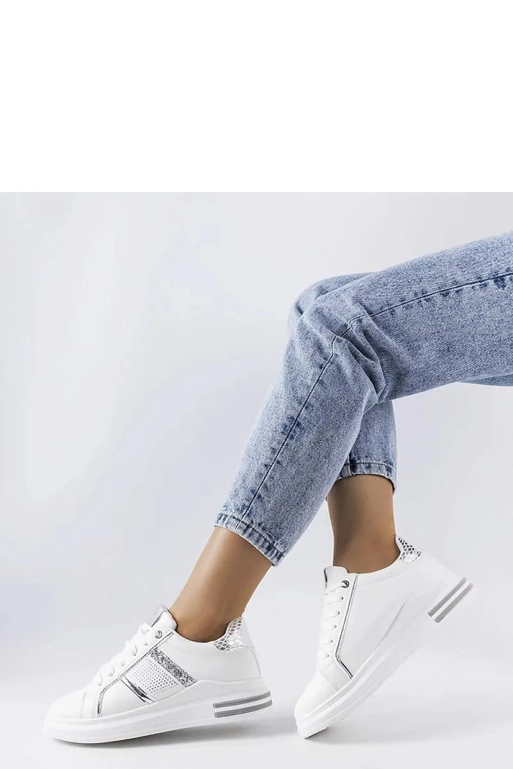 Beige sneakers adorned with rhinestones