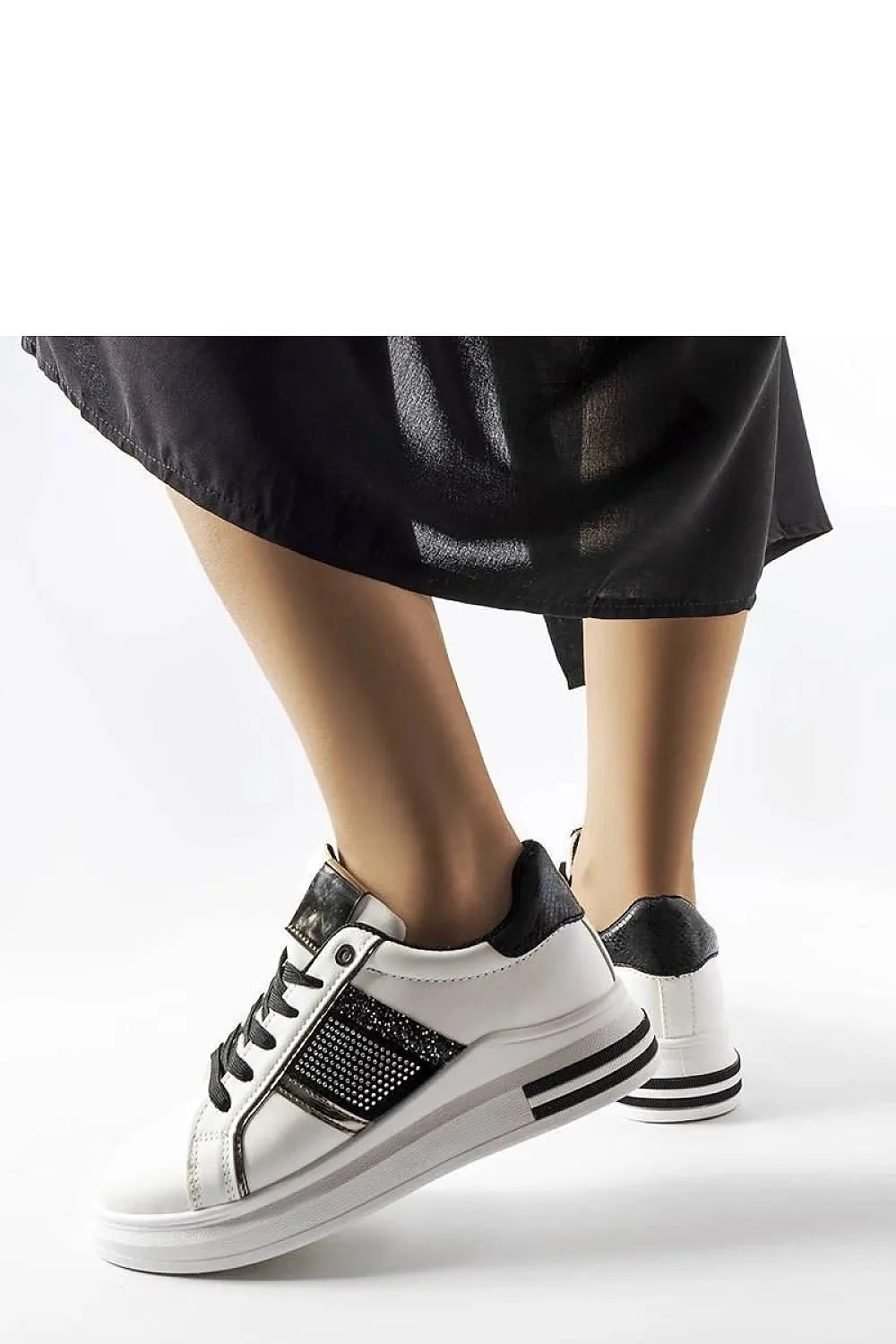 Beige sneakers adorned with rhinestones