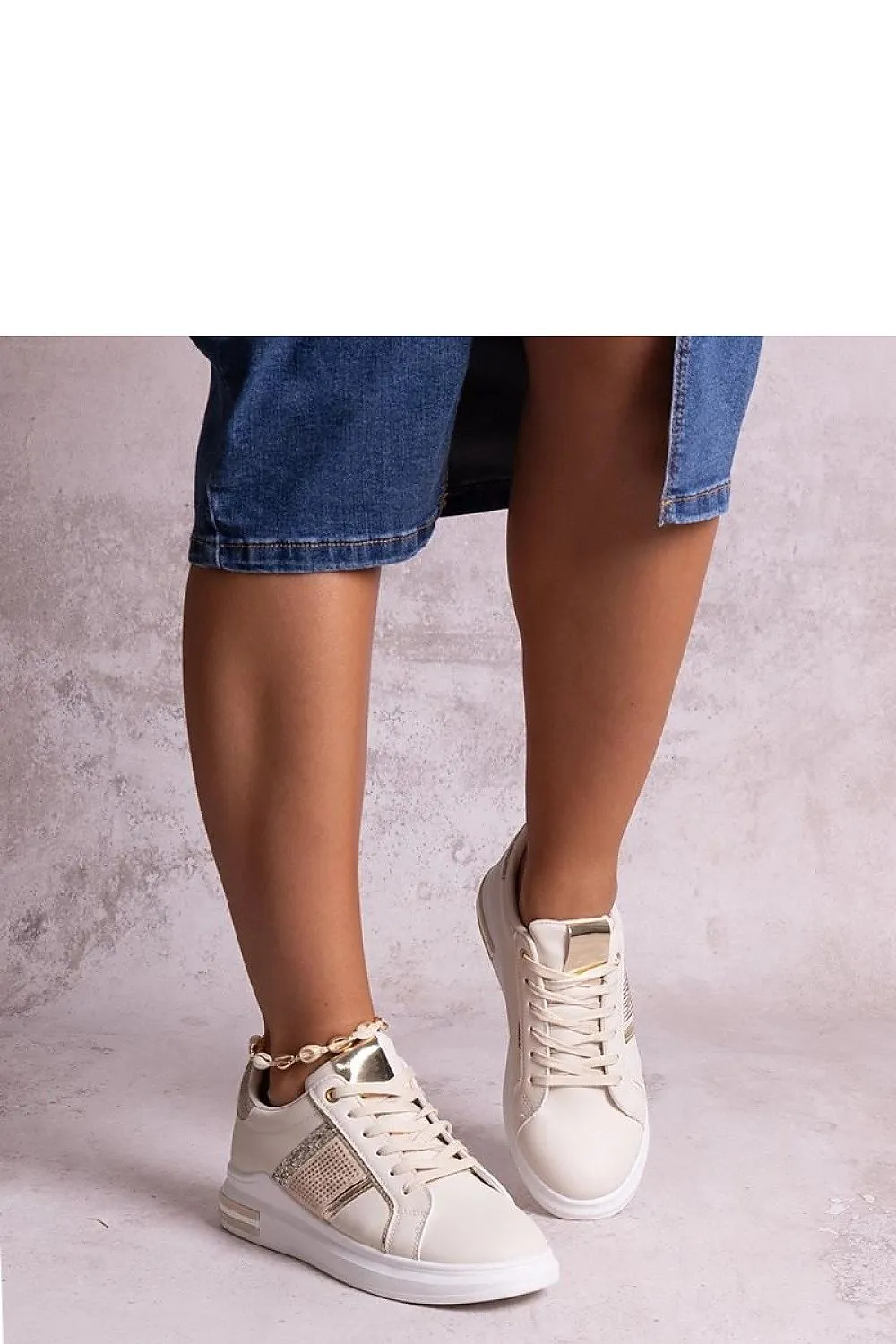 Beige sneakers adorned with rhinestones